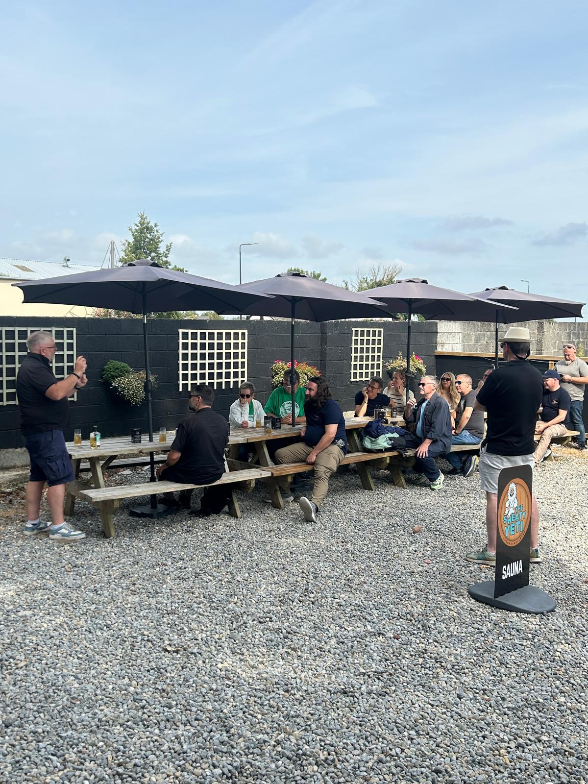 lough ree distillery - people on outdoor tables enjoying Bespoke Experiences
